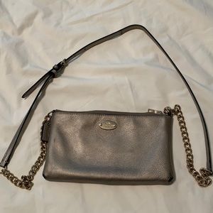 Gold coach zippered crossbody bag.